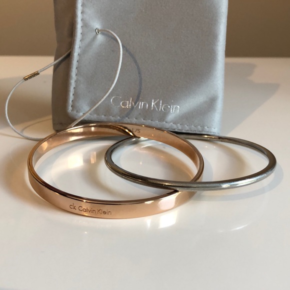 Calvin Klein Jewelry - Calvin Klein interlocking Gold and Silver bangles
